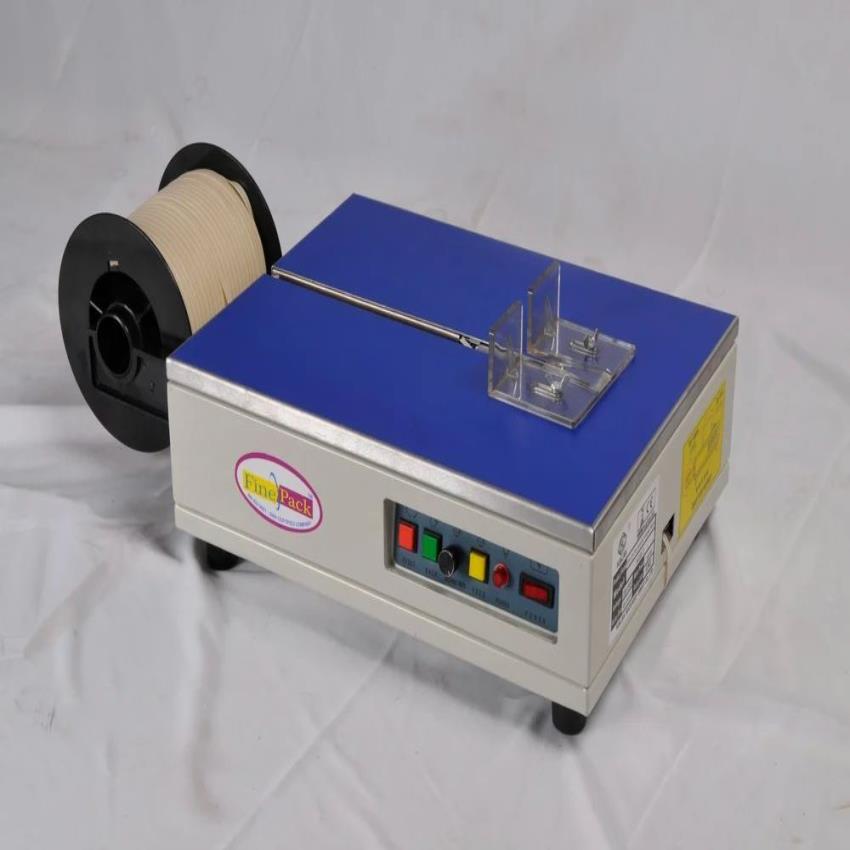 AUTOMATIC TABLE TOP STRAPPING MACHINE
